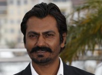 Indian actor Nawazuddin Siddiqui poses on May 18, 2013 during a photocall for the film "Monsoon Shootout" presented Out of Competition at the 66th edition of the Cannes Film Festival in Cannes. Cannes, one of the world's top film festivals, opened on May 15 and will climax on May 26 with awards selected by a jury headed this year by Hollywood legend Steven Spielberg. AFP PHOTO / VALERY HACHE