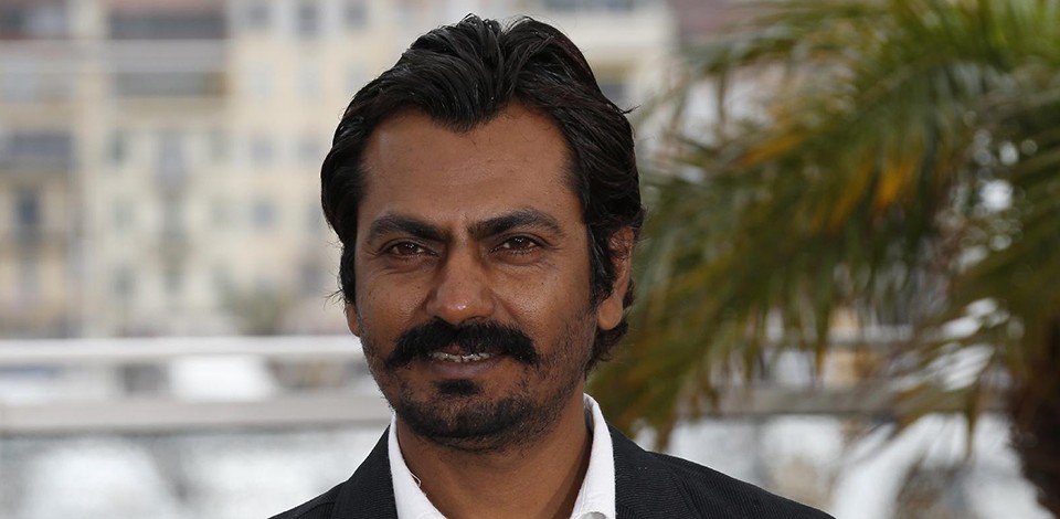 Indian actor Nawazuddin Siddiqui poses on May 18, 2013 during a photocall for the film "Monsoon Shootout" presented Out of Competition at the 66th edition of the Cannes Film Festival in Cannes. Cannes, one of the world's top film festivals, opened on May 15 and will climax on May 26 with awards selected by a jury headed this year by Hollywood legend Steven Spielberg. AFP PHOTO / VALERY HACHE