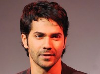 Indian Bollywood actor Varun Dhawan poses for a photograph during a promotional event in Mumbai on late May 8, 2014.  AFP PHOTO/STR