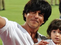 Kolkata: Kolkata Knight Riders (KKR) co-owner and actor Shah Rukh Khan with his son AbRam at the Eden Gardens during an IPL-2015 match between Kolkata Knight Riders and Mumbai Indians in Kolkata, on April 8, 2015. (Photo: IANS)