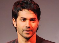 Indian Bollywood actor Varun Dhawan poses for a photograph during a promotional event in Mumbai on late May 8, 2014.  AFP PHOTO/STR