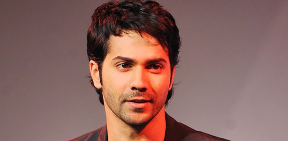 Indian Bollywood actor Varun Dhawan poses for a photograph during a promotional event in Mumbai on late May 8, 2014.  AFP PHOTO/STR