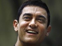 Bollywood actor Aamir Khan smiles as he takes questions from a journalist during a press conference to promote his new film "Talaash," or Search, at his residence in Mumbai, India, Tuesday, Dec. 4, 2012. (AP Photo/Rafiq Maqbool)
