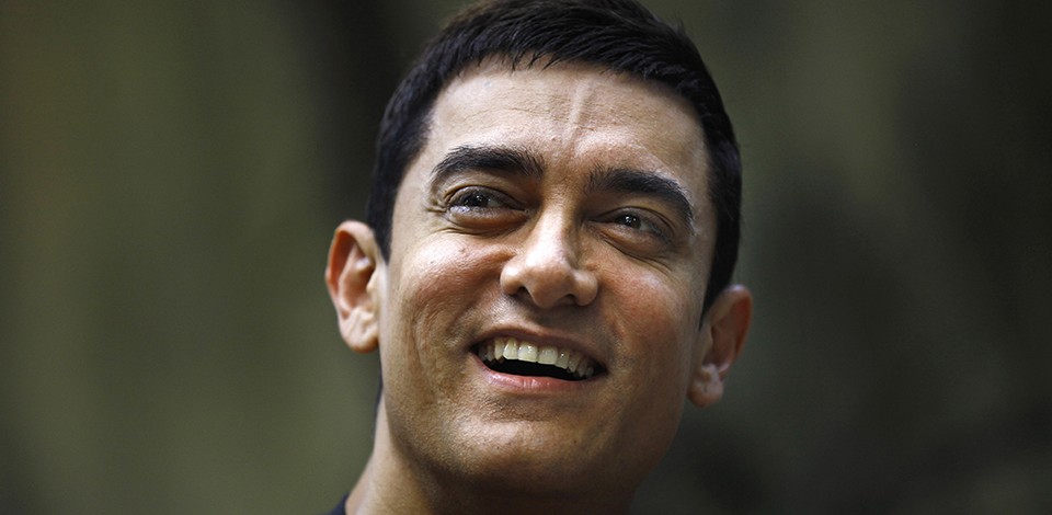 Bollywood actor Aamir Khan smiles as he takes questions from a journalist during a press conference to promote his new film "Talaash," or Search, at his residence in Mumbai, India, Tuesday, Dec. 4, 2012. (AP Photo/Rafiq Maqbool)