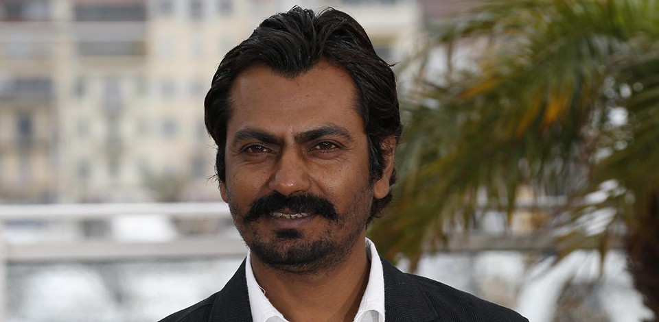 Indian actor Nawazuddin Siddiqui poses on May 18, 2013 during a photocall for the film "Monsoon Shootout" presented Out of Competition at the 66th edition of the Cannes Film Festival in Cannes. Cannes, one of the world's top film festivals, opened on May 15 and will climax on May 26 with awards selected by a jury headed this year by Hollywood legend Steven Spielberg. AFP PHOTO / VALERY HACHE