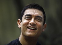 Bollywood actor Aamir Khan smiles as he takes questions from a journalist during a press conference to promote his new film "Talaash," or Search, at his residence in Mumbai, India, Tuesday, Dec. 4, 2012. (AP Photo/Rafiq Maqbool)