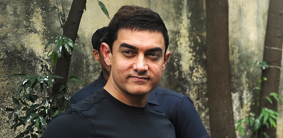 Bollywood film actor Aamir Khan poses after a press conference in Mumbai on December 4, 2012.   Khan, dubbed as Indian cinema's Mr Perfectionist returned to the big screen in his first commercial film release for three years, taking up the role of a mustachioed police inspector in a Mumbai crime thriller "Talaash" (Search).  Earlier this year Khan launched a 13-episode Sunday morning television show that won plaudits for tackling some of India's darkest social problems, drawing comparisons between him and US chat show host Oprah Winfrey.  AFP PHOTO/INDRANIL MUKHERJEE