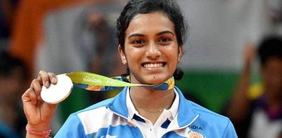 Rio de Janeiro: India's Pusarla V Sindhu poses with her silver medal after her match with Spain's Carolina Marin in women's Singles final at the 2016 Summer Olympics at Rio de Janeiro in Brazil on Friday. PTI Photo by Atul Yadav    (PTI8_19_2016_000286b)